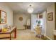 Neutral living room with a chandelier, dining area, and hardwood flooring at 8229 Cottongrass Ct, Castle Pines, CO 80108