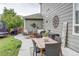 Back patio features an outdoor dining area and a comfortable seating area surrounded by landscaping at 8229 Cottongrass Ct, Castle Pines, CO 80108