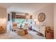 Cozy bedroom sitting area with comfortable chairs, ottoman, and soft natural light at 8229 Cottongrass Ct, Castle Pines, CO 80108