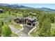 Aerial view of a modern home with mountain views at 444 Glen Eagle Loop, Breckenridge, CO 80424