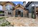 Rear exterior showcasing patio and access to the main bedroom at 444 Glen Eagle Loop, Breckenridge, CO 80424