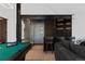 Basement bar with glass enclosed wine cellar and seating at 444 Glen Eagle Loop, Breckenridge, CO 80424