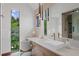 Bright bathroom featuring a vanity with sink, window view and luxurious glass shower for a spa-like experience at 444 Glen Eagle Loop, Breckenridge, CO 80424