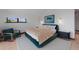 Comfortable bedroom with large windows, a cozy chair and stylish furniture at 444 Glen Eagle Loop, Breckenridge, CO 80424