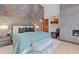 Serene bedroom featuring a fireplace, modern furnishings, and soothing color palette at 444 Glen Eagle Loop, Breckenridge, CO 80424