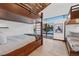 Bedroom with wood plank ceilings, a bunkbed, modern windows, and an artistic wall decoration at 444 Glen Eagle Loop, Breckenridge, CO 80424