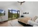 Bright bedroom featuring a large window with views of the mountains and trees at 444 Glen Eagle Loop, Breckenridge, CO 80424