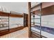 Bedroom features bunkbeds, wooden beams, a neutral rug, and storage space at 444 Glen Eagle Loop, Breckenridge, CO 80424