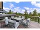 Deck featuring outdoor seating and views of trees at 444 Glen Eagle Loop, Breckenridge, CO 80424