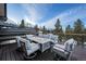 Outdoor deck includes a seating area around a fire pit and mountain views at 444 Glen Eagle Loop, Breckenridge, CO 80424