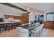 Beautiful open-concept dining room with modern lighting, breakfast bar, and sleek wooden cabinets at 444 Glen Eagle Loop, Breckenridge, CO 80424