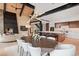 Stylish dining area open to the kitchen, featuring a modern fireplace, hardwood floors, and a unique light fixture at 444 Glen Eagle Loop, Breckenridge, CO 80424