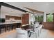 Open-concept dining area featuring a modern chandelier, breakfast nook, and kitchen island with bar seating at 444 Glen Eagle Loop, Breckenridge, CO 80424