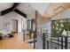 Spacious foyer with hardwood floors, modern railing, and mountain views through large windows at 444 Glen Eagle Loop, Breckenridge, CO 80424