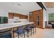Modern kitchen with island, breakfast bar seating, custom cabinets, and upscale appliances at 444 Glen Eagle Loop, Breckenridge, CO 80424
