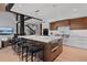 Bright open kitchen features large center island, breakfast bar, and stainless appliances at 444 Glen Eagle Loop, Breckenridge, CO 80424