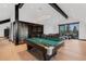 Open concept living room with bar, comfortable seating, and vaulted ceilings at 444 Glen Eagle Loop, Breckenridge, CO 80424