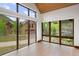 Bright living room featuring floor to ceiling windows showcasing beautiful views of nature at 444 Glen Eagle Loop, Breckenridge, CO 80424