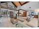 Spacious living room with staircase, kitchen, and dining area with high ceilings at 444 Glen Eagle Loop, Breckenridge, CO 80424