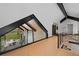 Open loft with views of the living room below and outdoor patio and fireplace at 444 Glen Eagle Loop, Breckenridge, CO 80424