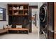 Stylish mudroom featuring custom built-ins, bench seating, and modern washer and dryer units for added convenience at 444 Glen Eagle Loop, Breckenridge, CO 80424