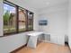 A modern office with custom shelving and a large window with a view of the outdoors at 444 Glen Eagle Loop, Breckenridge, CO 80424