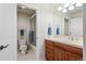 Clean bathroom with a glass shower, vanity with wooden cabinets, and tiled floor at 5329 Pinyon Jay Rd, Parker, CO 80134