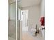 Bathroom featuring tiled shower, toilet, neutral tile flooring and a stylish towel rack at 5329 Pinyon Jay Rd, Parker, CO 80134