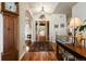 Inviting foyer featuring hardwood floors, high ceilings, a decorative rug, and an elegant chandelier at 5329 Pinyon Jay Rd, Parker, CO 80134