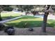 Lush front yard featuring mature trees, a well-maintained lawn, and several deer resting peacefully at 5329 Pinyon Jay Rd, Parker, CO 80134