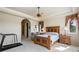 Serene main bedroom featuring a ceiling fan, en-suite access and a cozy sitting area at 5329 Pinyon Jay Rd, Parker, CO 80134