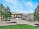 Landscaped backyard with patio and grill area at 4840 Limestone Rd, Monument, CO 80132