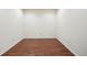 Basement area featuring wood-look flooring, neutral walls, and ample space at 7370 S Catawba Way, Aurora, CO 80016