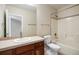 Cozy bathroom featuring a tiled vanity, toilet, and a shower-tub combination at 7370 S Catawba Way, Aurora, CO 80016