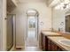 Bright bathroom featuring double vanities, shower and large mirrors at 7370 S Catawba Way, Aurora, CO 80016