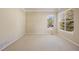 Carpeted bedroom with large windows allowing lots of natural light, perfect for creating a serene and inviting space at 7370 S Catawba Way, Aurora, CO 80016