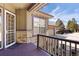 Inviting front porch with storm door and decorative stone accents, leading into the residence at 7370 S Catawba Way, Aurora, CO 80016