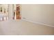 Spacious living room featuring a carpeted floor and an open layout, creating an inviting atmosphere for relaxation at 7370 S Catawba Way, Aurora, CO 80016