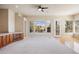Spacious living area with large windows and a cabinet perfect for entertaining, offering natural light and charm at 7370 S Catawba Way, Aurora, CO 80016