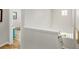 Upstairs hallway with hardwood floors leading to bedrooms and natural light at 1047 Uinta Way, Denver, CO 80230