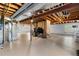 Open unfinished basement space with exposed utilities, stairs and small window at 11703 S Rock Willow Way, Parker, CO 80134