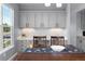 Cozy dining area featuring modern cabinets, counter space, and natural light from a window at 11703 S Rock Willow Way, Parker, CO 80134