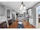 Open floor plan of the home featuring a dining room set and views of the kitchen and the living room at 11703 S Rock Willow Way, Parker, CO 80134