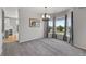 Well-lit dining room with neutral tones, bay windows with nice views, and modern lighting at 11703 S Rock Willow Way, Parker, CO 80134