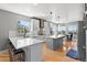 Bright kitchen featuring an island, white countertops, stainless steel appliances, and an open design at 11703 S Rock Willow Way, Parker, CO 80134