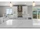 Close up shot of the kitchen featuring white countertops, a decorative backsplash, and stainless steel appliances at 11703 S Rock Willow Way, Parker, CO 80134