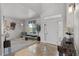 Bright living room with hardwood floors, a large window, and stylish decor at 11703 S Rock Willow Way, Parker, CO 80134
