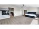 Large main bedroom featuring a fireplace, carpeted flooring, and ensuite bathroom access at 11703 S Rock Willow Way, Parker, CO 80134
