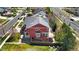 Aerial view of the rear of the home with a large deck, bay window, and manicured lawn at 11703 S Rock Willow Way, Parker, CO 80134