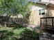 Backyard features landscaping, wooden fencing and mature trees at 21444 E Lehigh Ave, Aurora, CO 80013